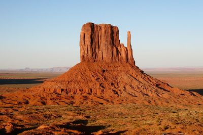 Rock formations in desert against clear sky