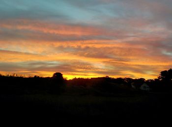 Scenic view of landscape at sunset