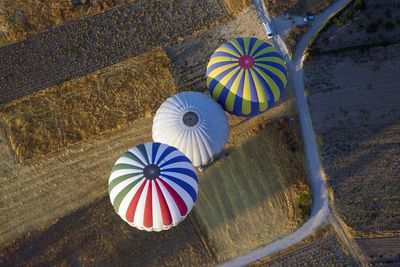 Aerial view of hot air balloons over landscape