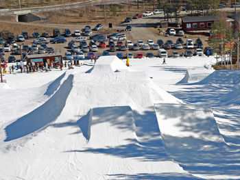 High angle view of crowd on snow covered city buildings