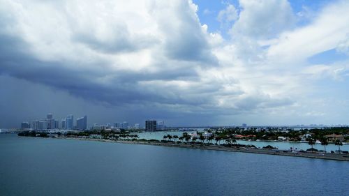 Cityscape against cloudy sky