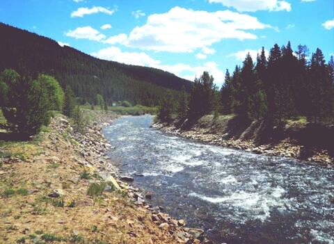 water, sky, tranquil scene, scenics, tree, tranquility, beauty in nature, nature, cloud - sky, stream, rock - object, river, flowing water, cloud, flowing, non-urban scene, idyllic, mountain, day, landscape