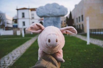 Cropped image of hand holding stuffed toy