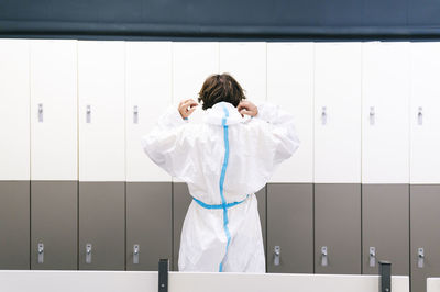 Mid adult man wearing protective work wear in hospital