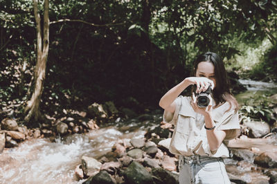 Series photo of young woman photographer with her camera shooting photo outdoor