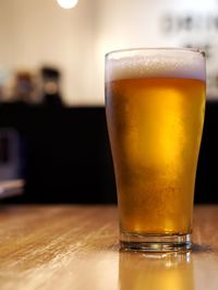 Close-up of beer in glass on table