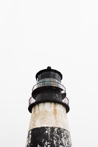 Low angle of part of old weathered beacon located on background of overcast sky