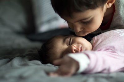 Boy sleeping on bed