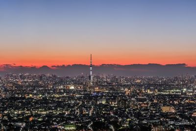 High angle view of buildings in city during sunset