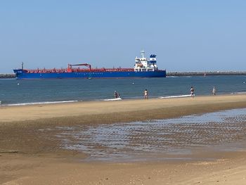 Scenic view of beach against clear sky