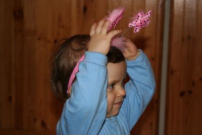 Midsection of man with pink hair