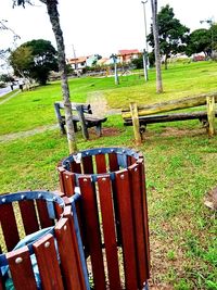 Wooden fence on field against sky