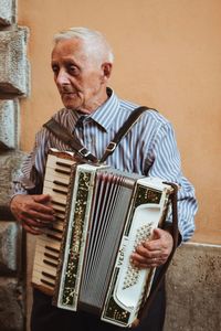 Portrait of man playing guitar