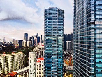 Modern buildings in city against sky