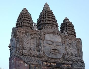 Low angle view of a temple against building