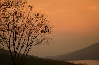 Scenic view of mountains against sky at sunset