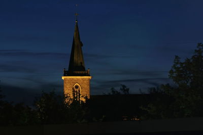 Traditional building against sky at night