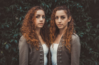 Portrait of young woman standing outdoors