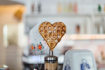 Close-up of heart shaped pastry against blurred background