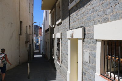 Alley amidst buildings in city