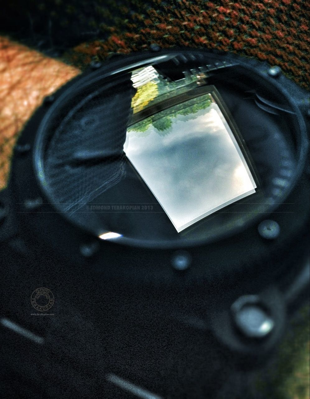 indoors, close-up, table, high angle view, still life, car, reflection, no people, selective focus, communication, metal, old, day, focus on foreground, single object, old-fashioned, art, glass - material, technology, part of