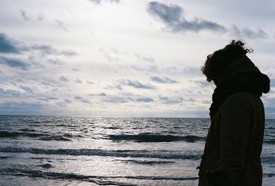 Scenic view of sea against cloudy sky