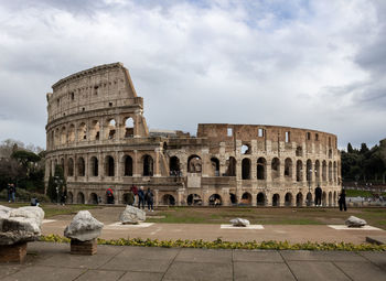 Low angle view of the colluseum in rome on a cloudy day