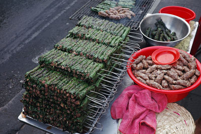 Fragrantly seasoned grilled rolls of beef wrapped up in wildbetel leaf on street of ho chi minh city