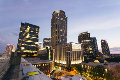 Modern buildings in city against sky