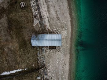 Aerial view of hut by sea