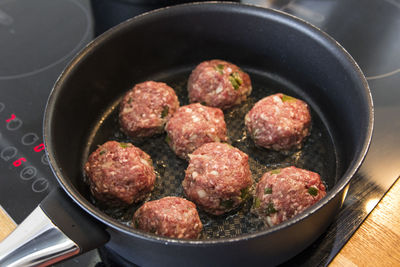 High angle view of meat in cooking pan