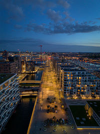 High angle view of illuminated cityscape against sky