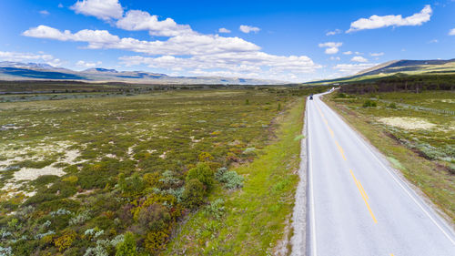 Road amidst landscape against sky