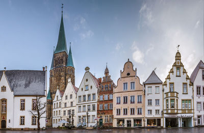 Buildings in city against sky