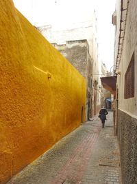 Man walking in alley