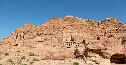 View of rock formations against blue sky