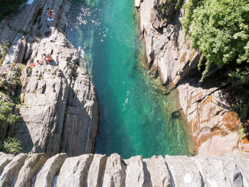 High angle view of rocks on sea shore