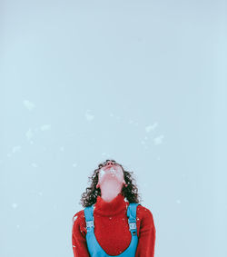 Portrait of woman standing in snow