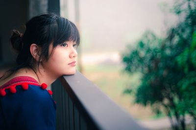 Portrait of young woman looking away