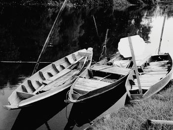 Boats moored on lake