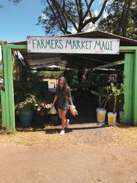 Woman with text written on plants