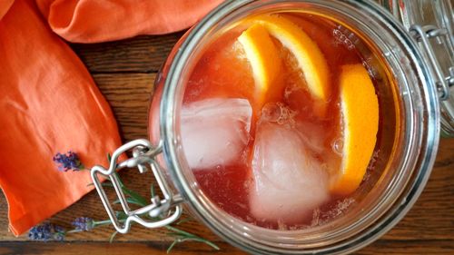 High angle view of fruit in glass jar on table