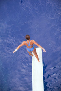 High angle view of young woman in swimming pool