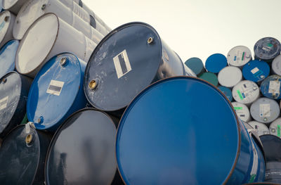 Old chemical barrels. blue oil drum. steel chemical tank. toxic waste warehouse. hazard chemical.