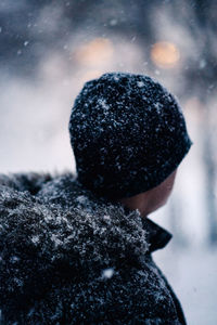 Rear view of person standing in snow