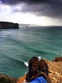 Scenic view of sea against cloudy sky