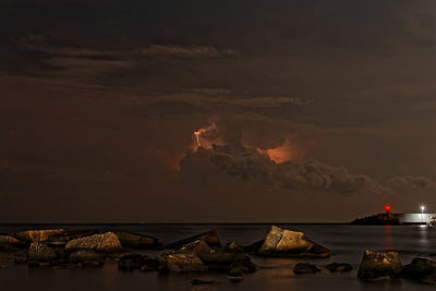 Scenic view of sea against sky at night