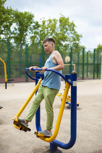 Side view of boy playing in playground