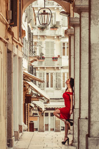 Side view of woman in corridor