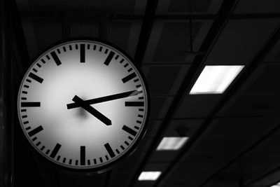 Low angle view of clock on wall